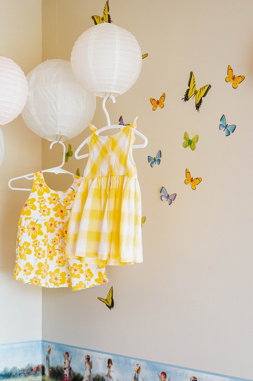 Paper lanterns and butterflies decorating the nursery
