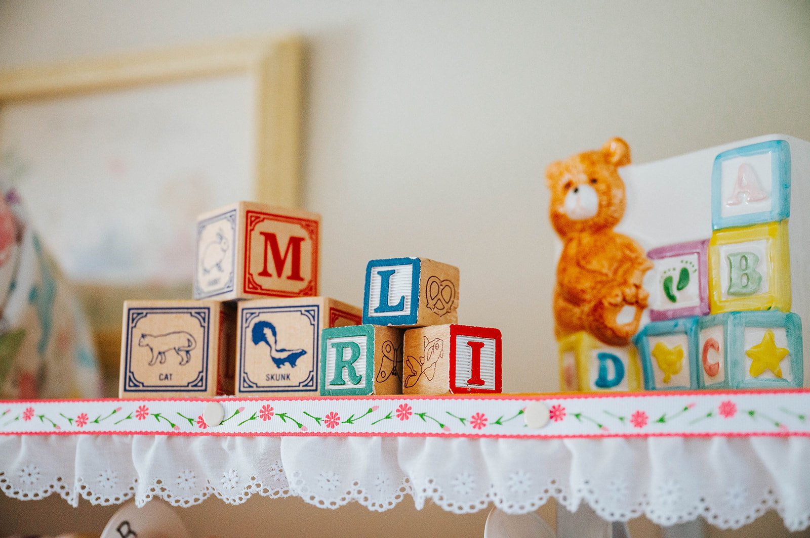 Alphabet blocks and a teddy bear in the Safe Choice nursery
