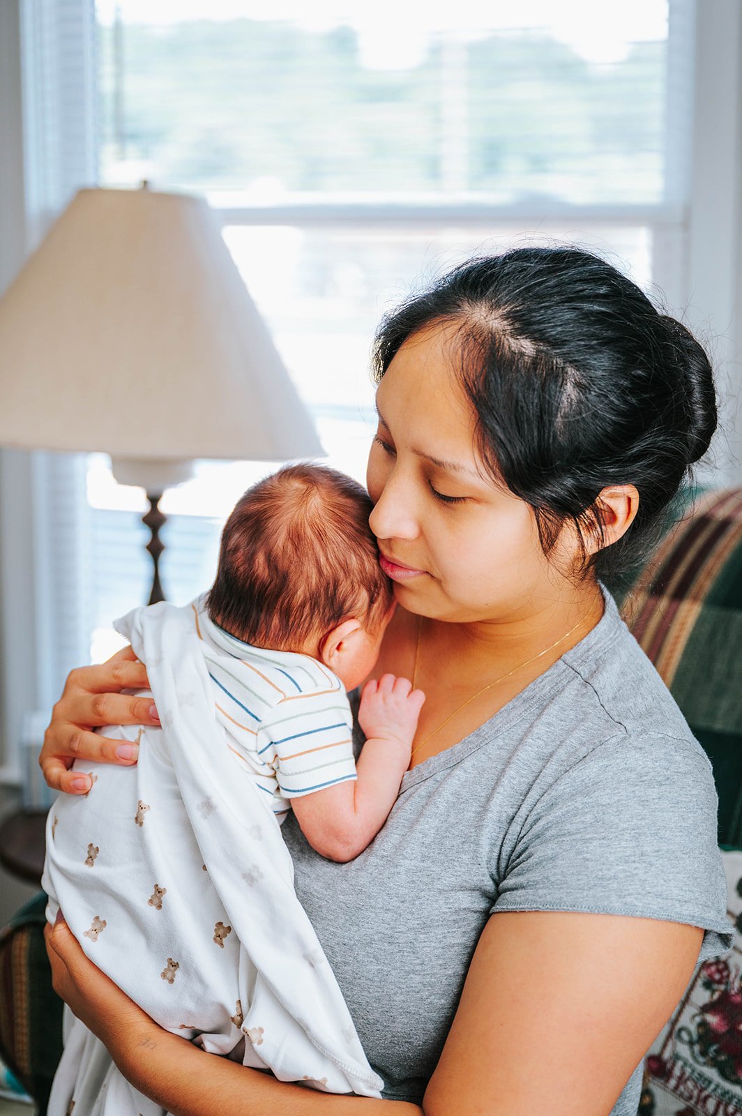A mother gazing at her newborn